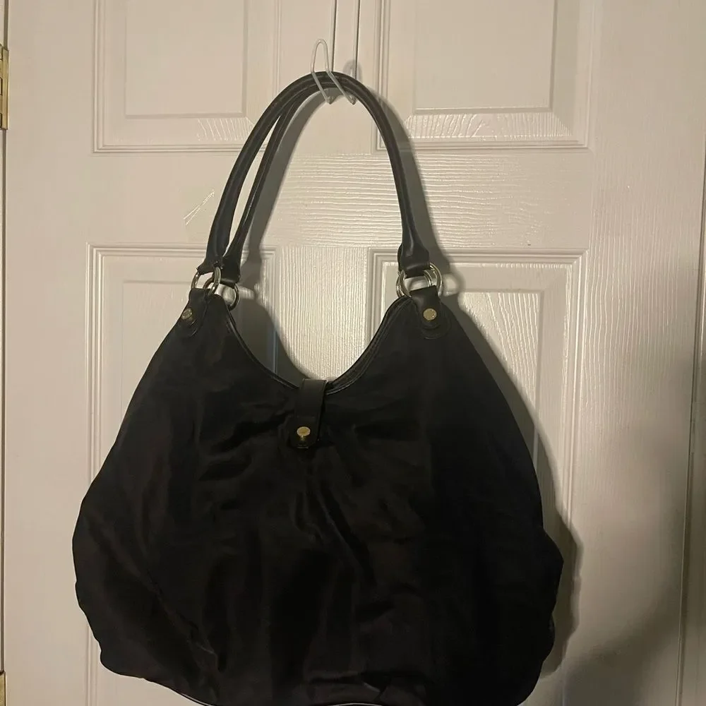 Calvin Klein Black Nylon large shoulder bag with gold tone hardwares.